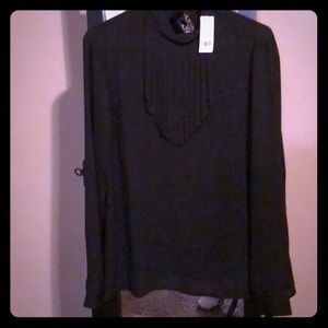 Black long sleeve ruffle top. NWT